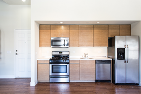 Los Angeles apartment for rent - a kitchen with stainless steel appliances and wooden cabinets
