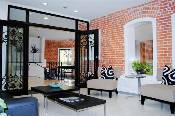 Los Angeles apartment for rent - a living room with furniture and a brick wall