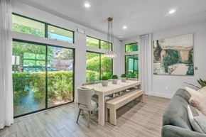 Atlanta apartment for rent - a dining room with a table and chairs and a large window
