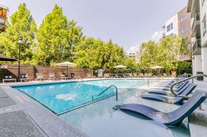 Atlanta apartment for rent - a swimming pool at a hotel with chairs around it