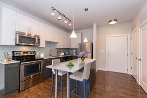 Atlanta apartment for rent - a kitchen with stainless steel appliances and a white counter top