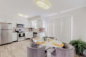 Glen Burnie townhouse for rent - a kitchen and dining room with a table and chairs