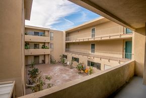 Los Angeles apartment for rent - a balcony view of an apartment building with a courtyard