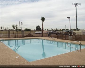 Phoenix apartment for rent - A small pool with a metal fence around it.