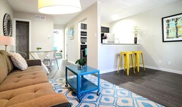 Austin apartment for rent - A living room with a brown couch and a blue coffee table.