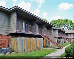 Gretna apartment for rent - a house with a deck and a fence