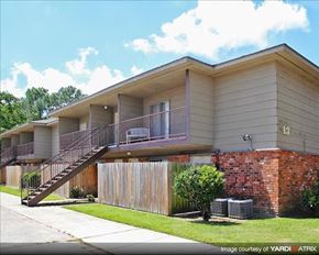 Gretna apartment for rent - a house with a staircase and a yard