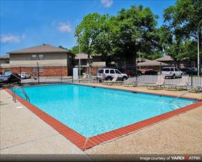 Gretna apartment for rent - a swimming pool with a fence around it