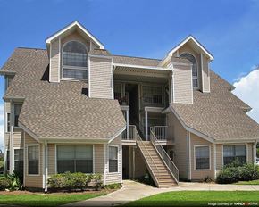 Gretna apartment for rent - the front of a house with stairs and a roof