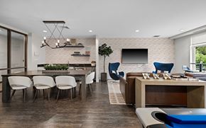 Cambridge apartment for rent - a clubhouse with a dining room and a bar and a television