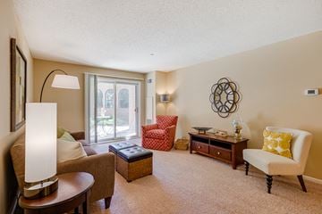 St. Paul apartment for rent - a living room with a couch and chairs and a window