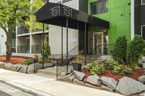 Hopkins apartment for rent - apartment entrance with a black awning that reads "151 on 8"