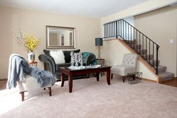 Woodbury townhouse for rent - a living room with a couch and chairs and a table