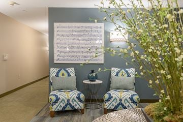 La Crosse apartment for rent - a living room with two chairs and a poster on the wall