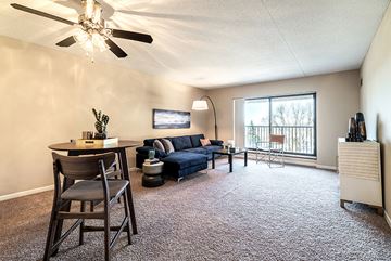 St. Paul apartment for rent - a living room with a couch and a table and a ceiling fan