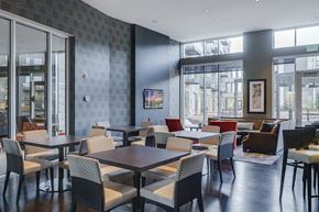 Edina apartment for rent - Community room with square tables with four chairs surrounding each of them