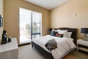 Edina apartment for rent - Bedroom with queen sized bed, nightstands with lamps, and a dresser