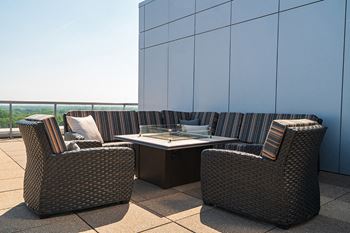 11Th floor roof-top deck with grilling station, high top and lounge seating, fire table and stunning sky line views