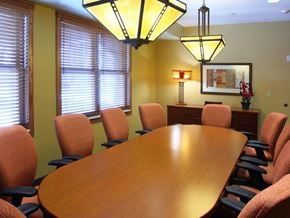 St. Paul apartment for rent - a conference room with a wooden table and chairs