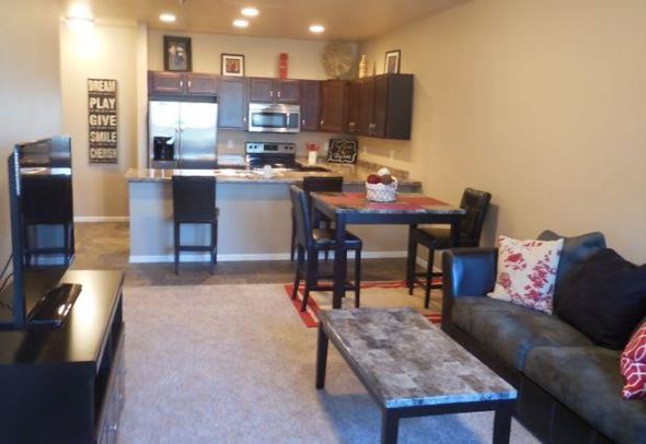 West Fargo townhouse for rent - a living room with a kitchen and a table