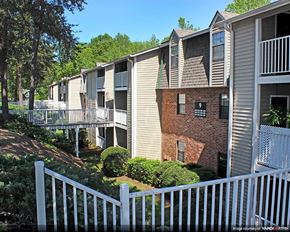 Greenville apartment for rent - an apartment building with a white fence