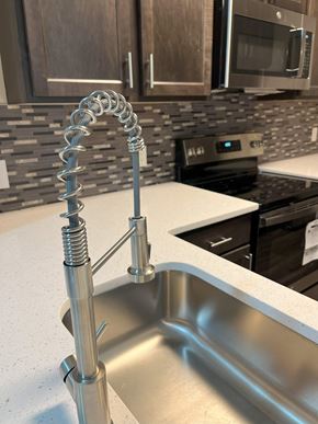 Charlotte apartment for rent - a kitchen with a faucet over a sink