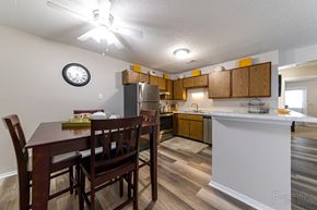 Ofallon apartment for rent - an open kitchen and dining area with a dining table and chairs