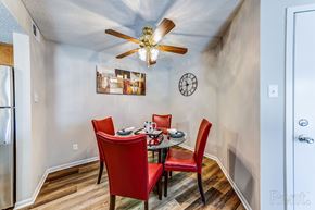 St. Charles apartment for rent - a dining room with a table and chairs and a ceiling fan