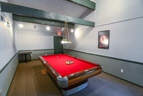 Florissant townhouse for rent - a pool table in a room with a red pool