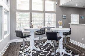 Overland Park apartment for rent - a dining room with tables and chairs in front of a window