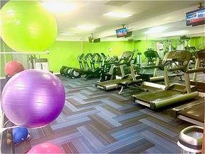 Hallandale Beach apartment for rent - a gym with a bunch of exercise equipment and balloons