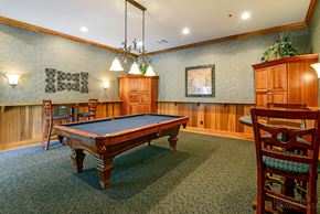 Chesterfield townhouse for rent - a game room with a pool table and chairs