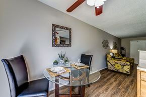 St. Louis apartment for rent - a dining room with a glass table and chairs