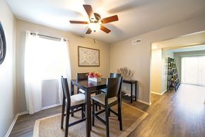 Manchester townhouse for rent - a dining room with a table and chairs and a ceiling fan