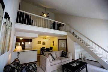 Fairview Heights apartment for rent - a living room with a couch and a staircase