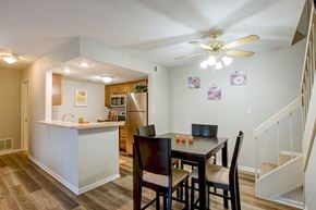Fairview Heights apartment for rent - a dining room with a table and chairs and a kitchen