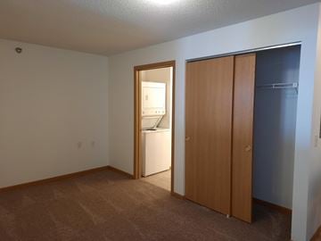 Chaska apartment for rent - a bedroom with a door to a bathroom and a closet