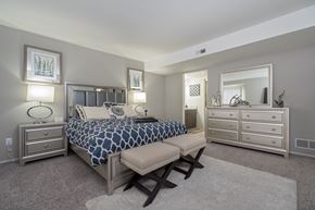 Farmington Hills apartment for rent - a bedroom with a bed and two dressers