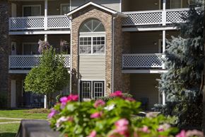 Westlake apartment for rent - the view of a building with flowers in front of it