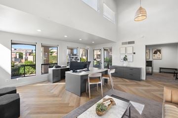 Tolleson apartment for rent - a living room with a desk and a table with chairs