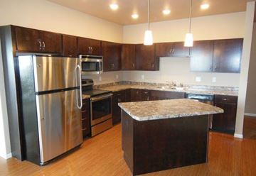 Fargo apartment for rent - a kitchen with a stainless steel refrigerator