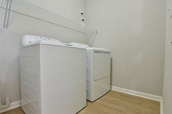 In-unit full-sized washer and dryer with organizer