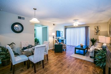 Chandler apartment for rent - a living room and dining room with a table and chairs