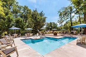 Brookline apartment for rent - a swimming pool with chairs and umbrellas at the resort