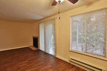 Mariner's glen apartments model with faux wood floor and wood-burning fireplace