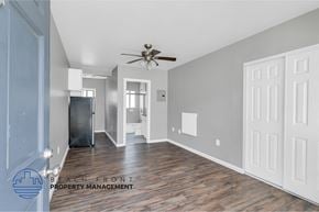 Long Beach apartment for rent - a renovated living room with wood flooring and a ceiling fan