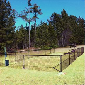Fayetteville triplex for rent - the park has a tennis court with a fence