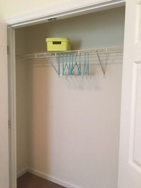 Fayetteville triplex for rent - an empty closet with a basket on a rack in it