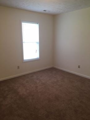 Fayetteville triplex for rent - an empty room with a window in it