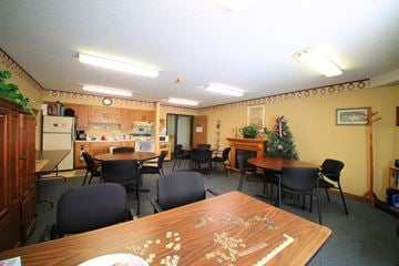Buffalo apartment for rent - a dining room with tables and chairs and a kitchen